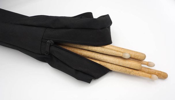 Drum sticks and black bags. - Photo, Image