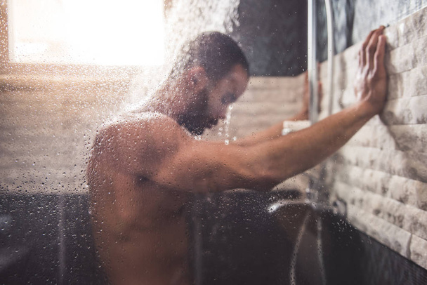 Afro American man taking shower - Foto, Imagem