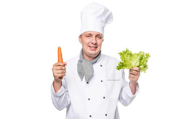 Portrait of a happy cook with fresh vegetables in the hands on a - Fotoğraf, Görsel