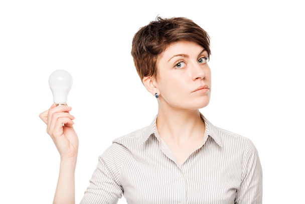 business woman with a light bulb in hand on white background - Fotó, kép