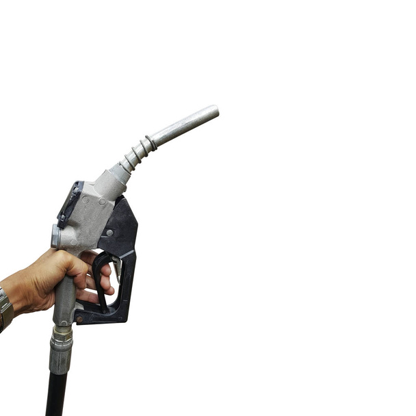 Mão segurando um bico de combustível
 - Foto, Imagem