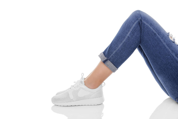 Female feet in sneakers. - Valokuva, kuva