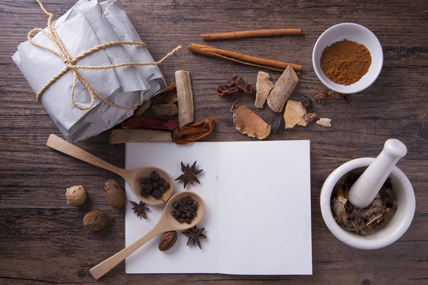 Herbal medicine on wood table with note book for learning medical practice - Фото, изображение
