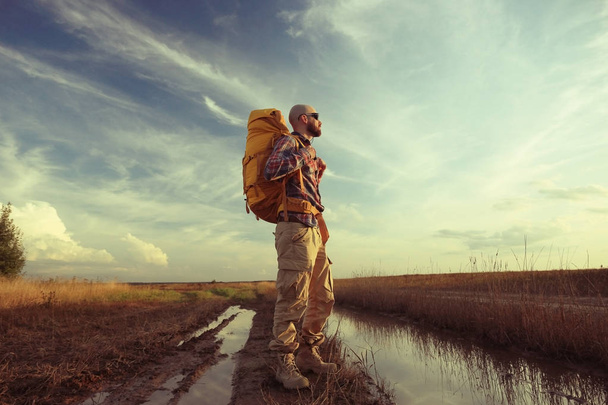 man traveler with a backpack - Fotó, kép