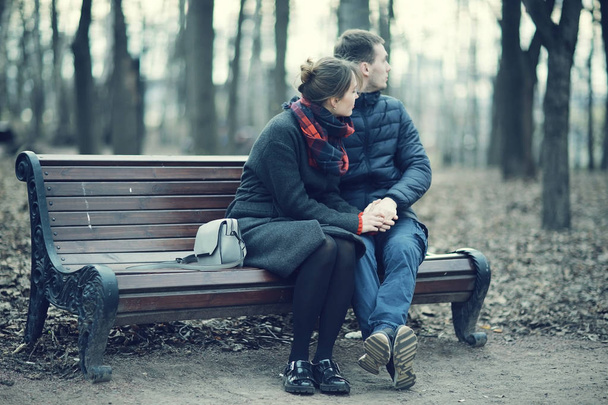 Couple sitting on a bench - Фото, изображение
