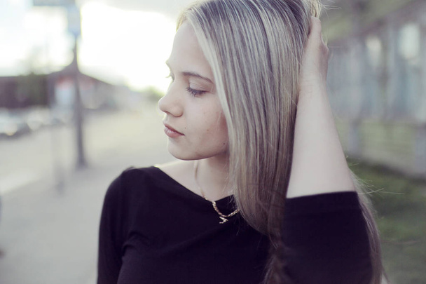 blonde with long hair outdoors - Fotó, kép