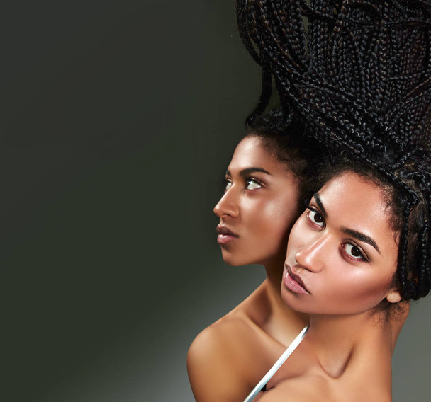 Beautiful African-American woman is reflected in a mirror.  - Zdjęcie, obraz