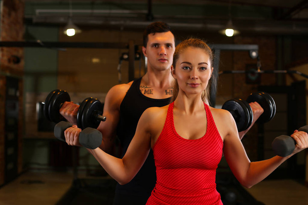 Sporty young smiling couple work out together - Photo, Image
