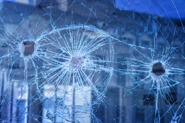 bullets pierced glass in the window - Photo, Image