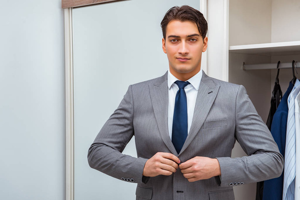 Businessman dressing up for work - Photo, Image