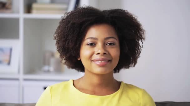 happy african american young woman face at home - Filmati, video