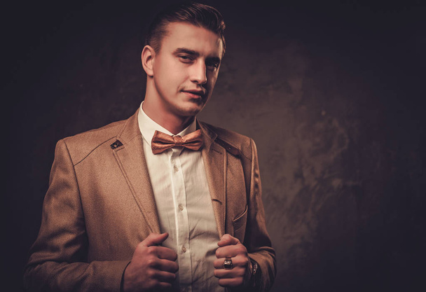 Sharp dressed man wearing jacket and bow tie - Photo, Image