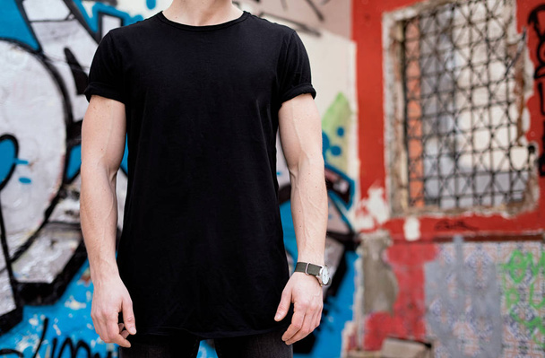 Young man wearing black tshirt - Foto, imagen
