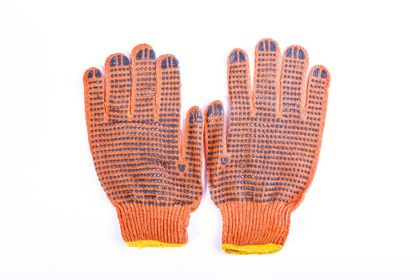 Fabric gloves. New yellow gloves which protect hands isolated.  - Photo, Image