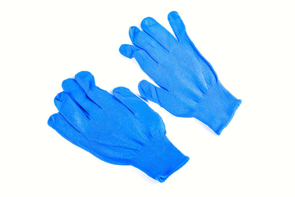 Сині рукавички для зварювальників, будівельників, садівників
.  - Фото, зображення
