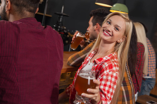 Young People Group In Bar, Girl Sitting At Wooden Counter Pub, Drink Beer - Photo, Image
