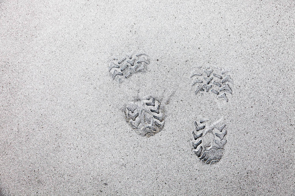 voetafdruk op vulkanische as - Foto, afbeelding