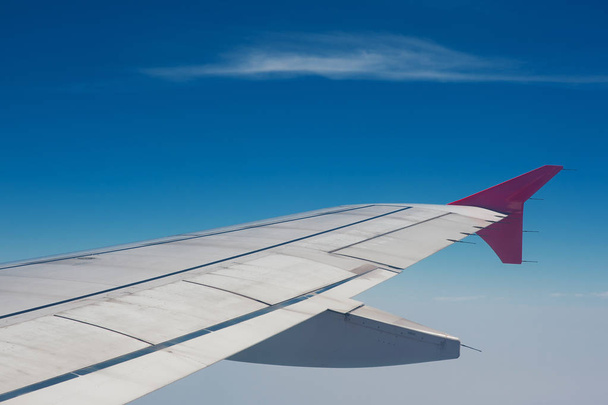 Wing of plane view from window - Φωτογραφία, εικόνα