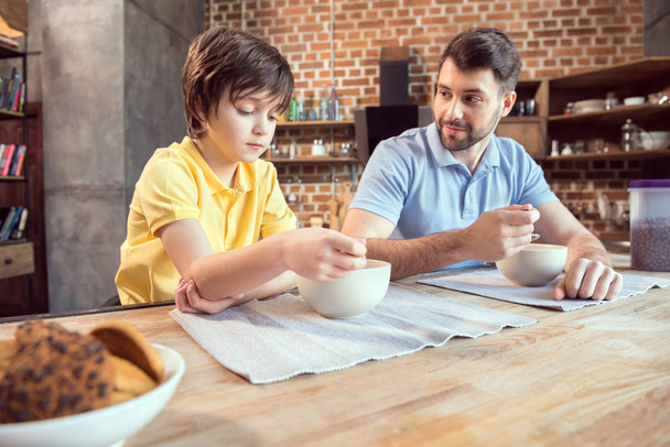 Father and son having breakfast - Photo, Image