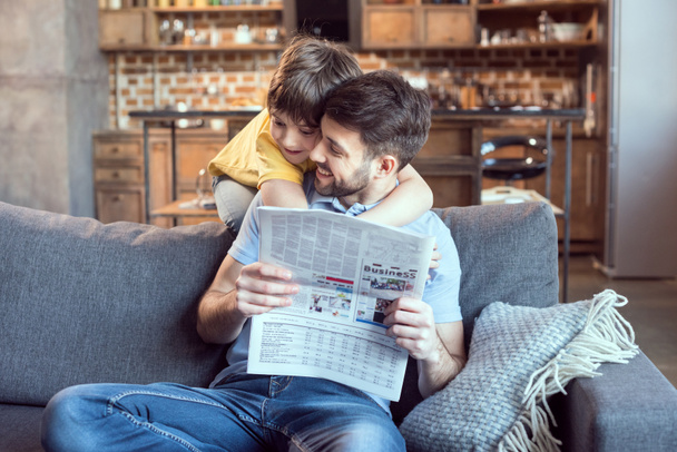 Father and son reading newspaper - Photo, Image