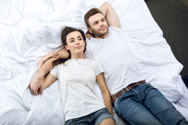 couple lying in bed - Photo, Image