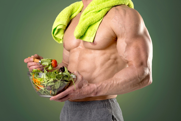 Healthy man eating a salad - Foto, imagen