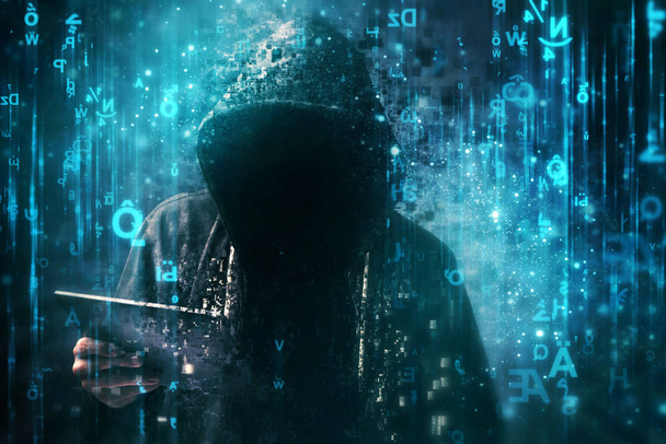 Computer hacker with hoodie in cyberspace surrounded by matrix c - Photo, image