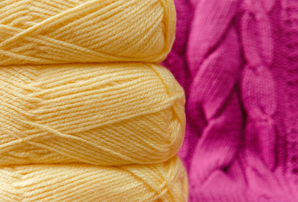 Yellow Balloon of Yarn on the Pink Knitted Item Background,Hand Made.Fancywork.Selective Focus. - Photo, Image