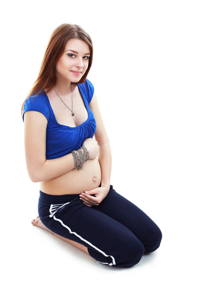 Expectant mother siting on floor - Photo, image