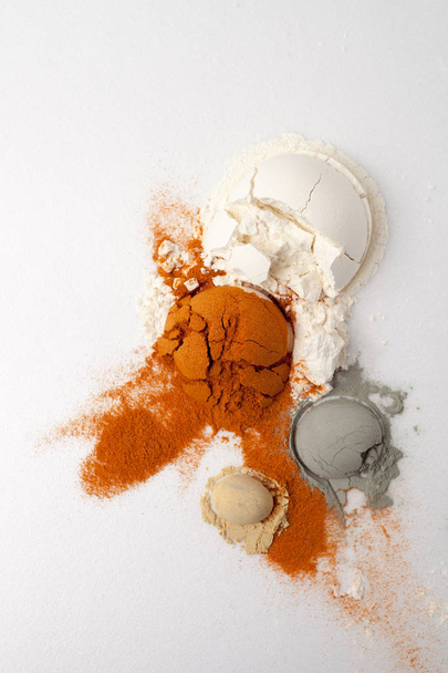 hemisphere of powder is split and cracked, flour, ground pepper, - Valokuva, kuva