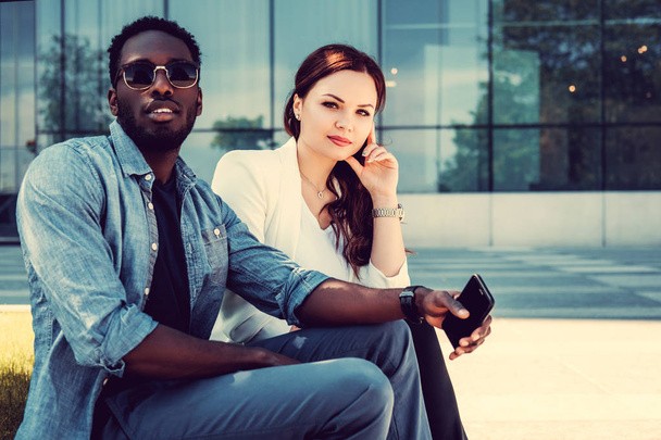 Black male and woman using smartphone - Photo, Image