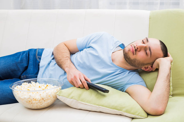 Man fell asleep while watching tv - Valokuva, kuva