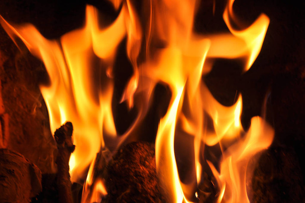 Fire flames on a black background. Blaze fire flame texture back - Photo, Image