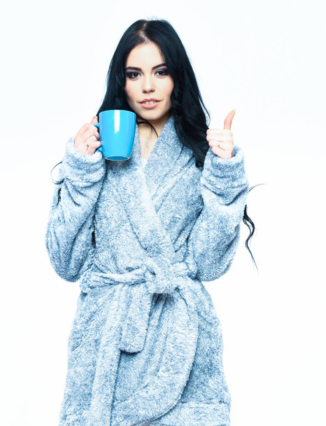 sexy girl posing in blue velour bathrobe with cup - Фото, изображение