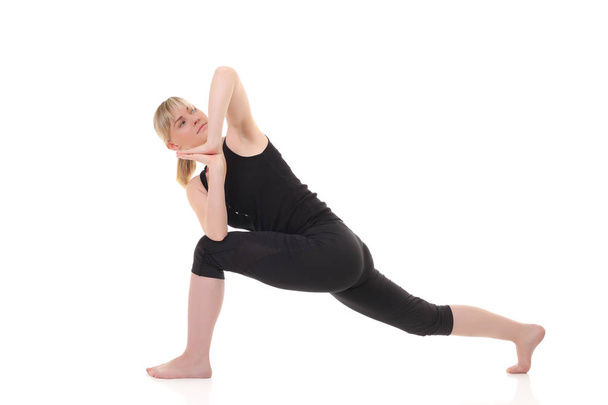 young yoga female doing yogatic exercise - Fotó, kép