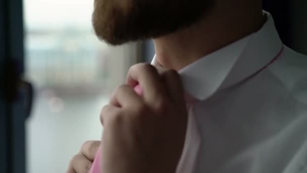 Man wearing tie near window - Filmati, video