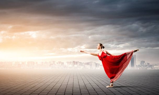 Passionate woman dancer in red dress  - 写真・画像