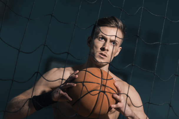 sporty man with basketball ball - Фото, изображение