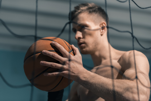 sporty man with basketball ball - 写真・画像