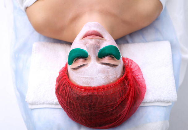 Green moisturizing mask under the eyes. - Photo, Image