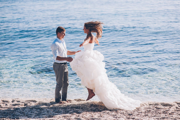 Bride and groom by sea  - Фото, изображение