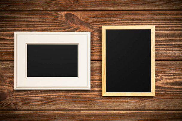 Picture frame on a wooden wall - 写真・画像