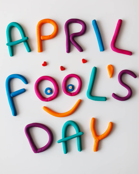 April Fools Day phrase made of plasticine colorful letters on background - Foto, Bild