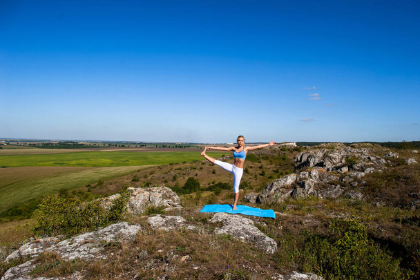 woman doing yoga exercise - Φωτογραφία, εικόνα