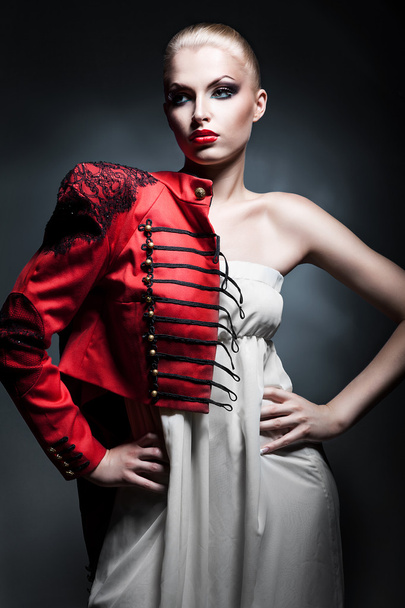attractive sexy blonde woman in red jacket with red lips - 写真・画像