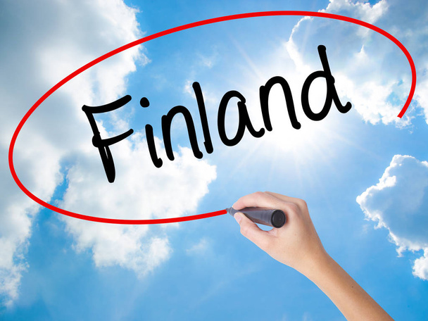 Woman Hand Writing Finland with black marker on visual screen. - Photo, Image
