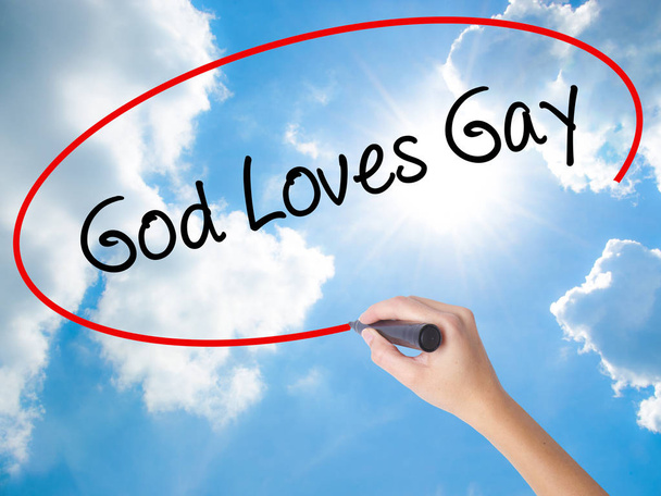 Mujer mano escritura dios ama gay con negro marcador en visual scr
 - Foto, imagen