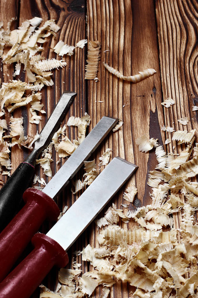 Woodworking tools. Chisel with sawdust .copy space.vertical shot - Foto, afbeelding