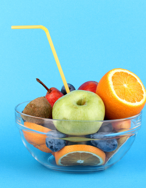 Glass bowl with fruit for diet on blue background - Fotografie, Obrázek
