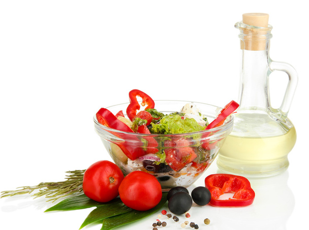 Fresh greek salad in glass bowl isolated on white - Foto, afbeelding